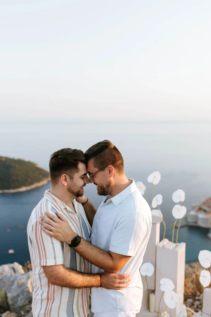 newly engaged couple hugging