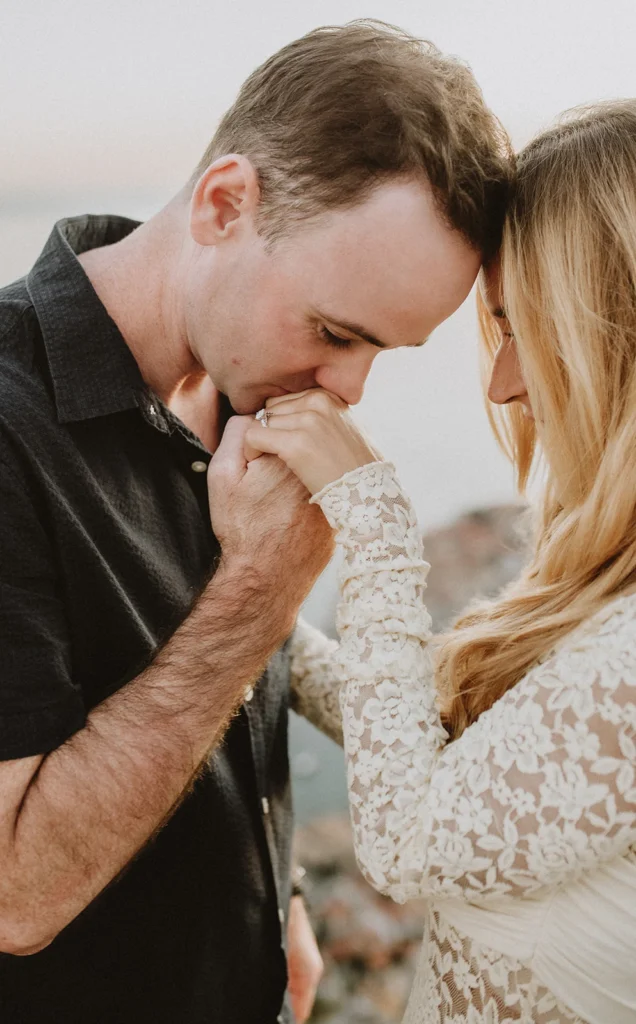 guy kissing his girlfriend hand