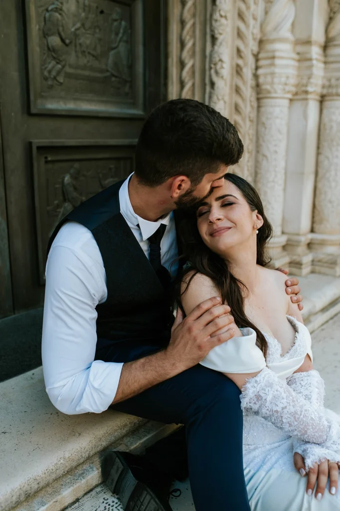 husband hugging and kissing his wife